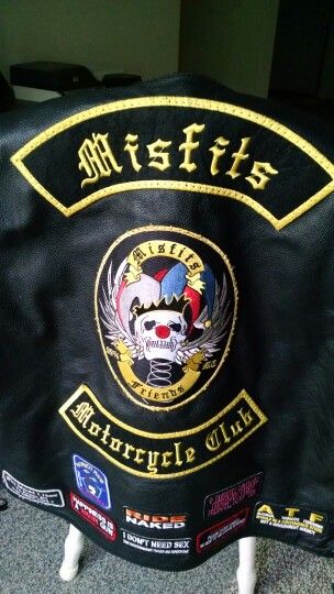 Misfits motorcycle club leather jacket with winged skull on spring wearing jester hat, reading Misfits Friends